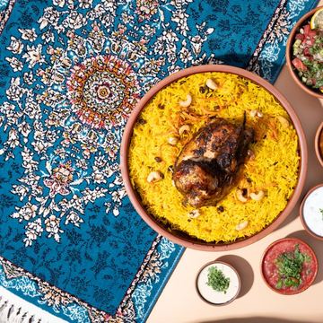 نصف دجاجة شواية مع رز بخاري